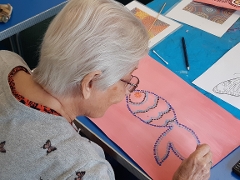 Older woman drawing