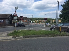 Cars waiting at Ash road level crossing