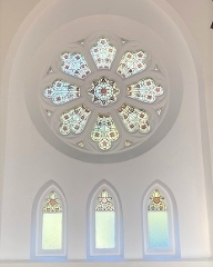 a circular stained glass window inside the chapel 