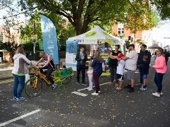 Person sat on a smoothie bike at Car Free Day 2022