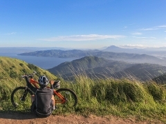 Person sat by their bike A person sat by their bike