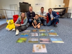 Mayor of Guildford calendar 2026 judging panel Judges in front of blurred winning entries