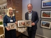 Mayor and Leader holding charity calendar 2026