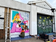 Street artwork at the Old Orleans building Street artwork being painted onto the Old Orleans building in Guildford