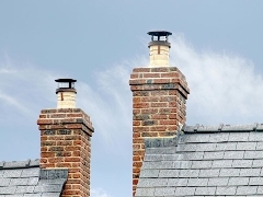 Smoke coming out of a house chimney